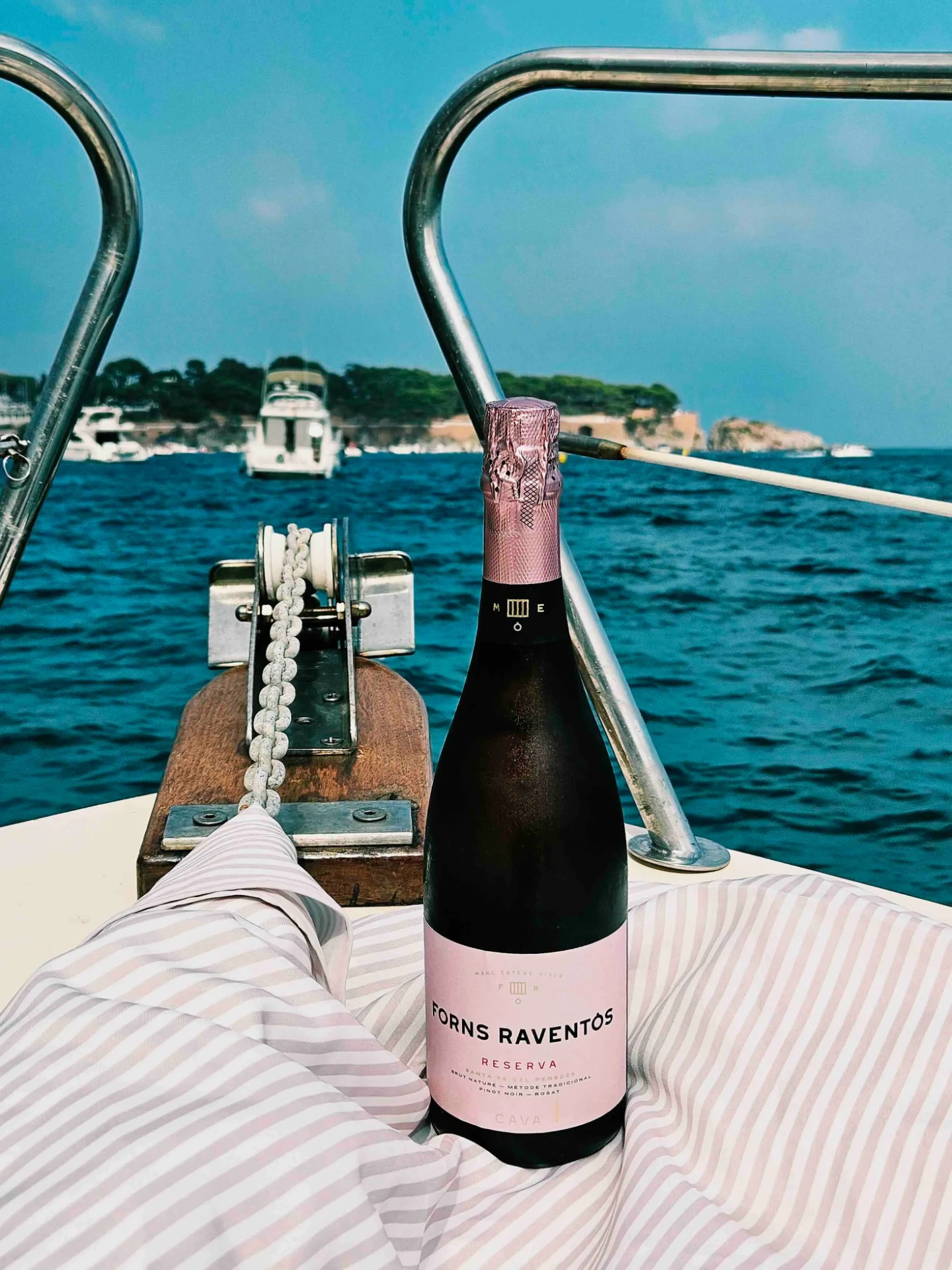 Bottle of premium Marc Esteve Vives rosé cava on board a Costa Brava boat charter