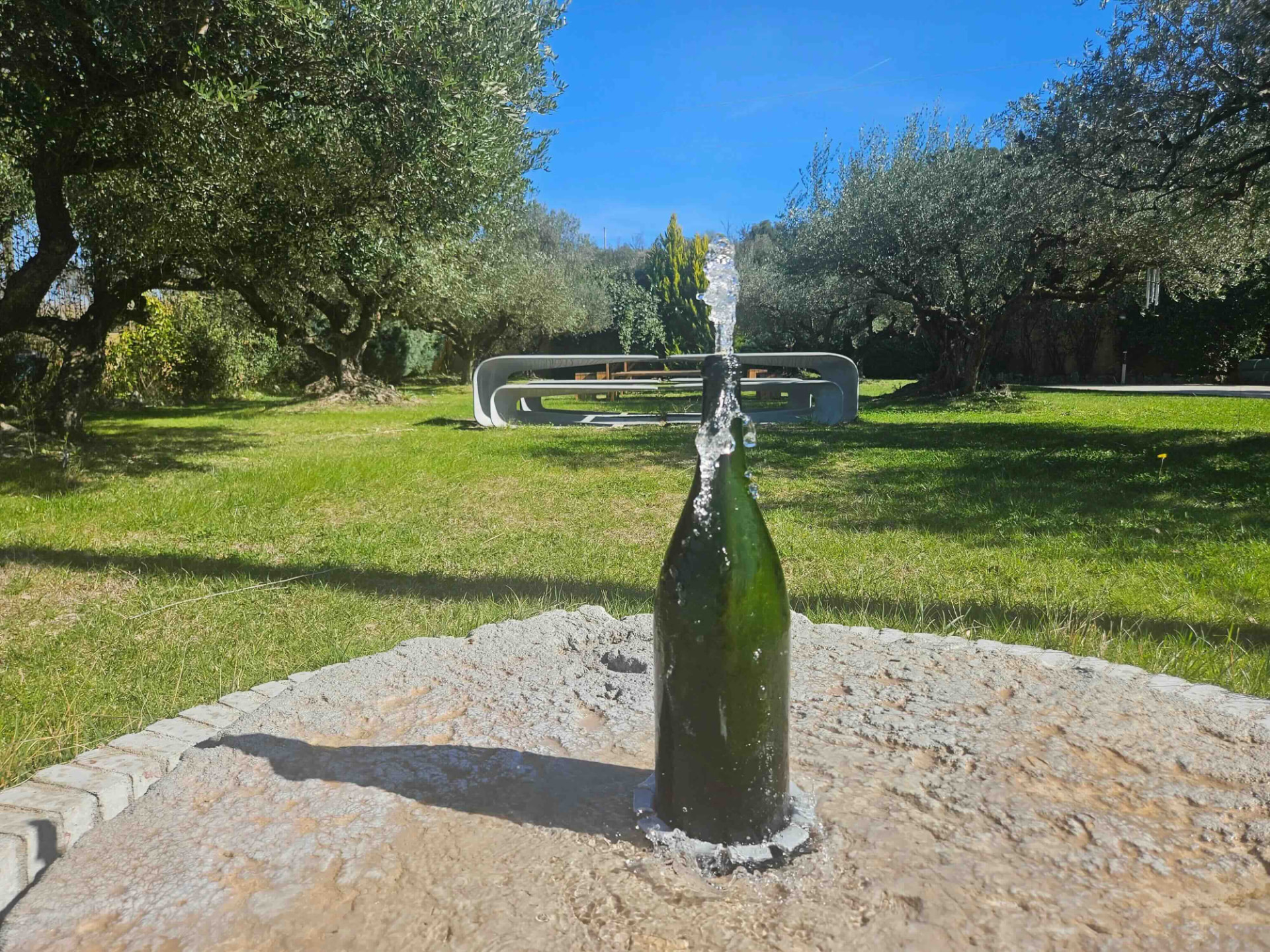 Cava bottle fountain in the gardens of the Llopart estate in Subirats