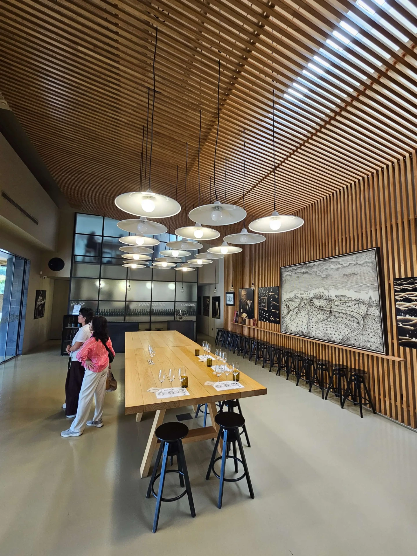 Llopart tasting room with long wooden table during a private wine tasting near Barcelona