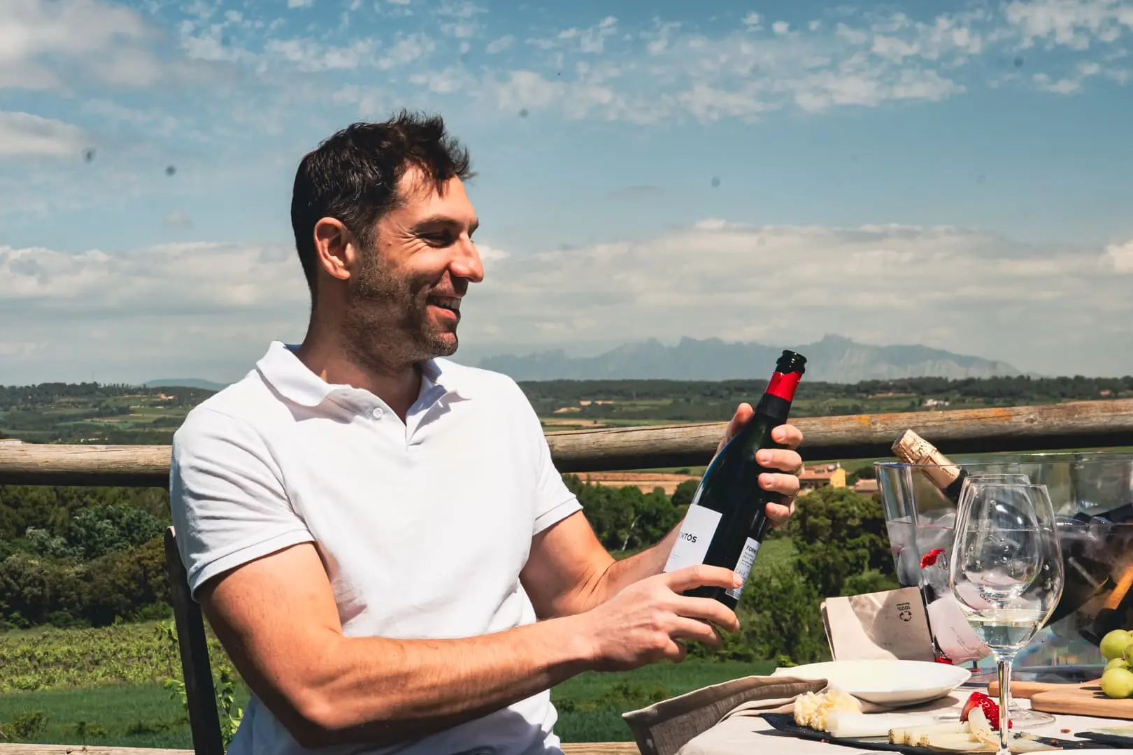 Host pouring wine at Marc Esteve Vives, a family winery in the Penedès
